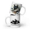Stacked view of the Water Mountain Yule Cat winter mug showing the Yule Cat mountain badge and minimalist mountain glyph on a 20 oz ceramic mug